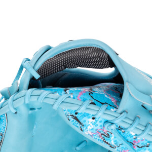 Interior view showing the Marucci Lizard Skins Cypress mitt's black mesh lining and bright blue, graphic-patterned palm lining.