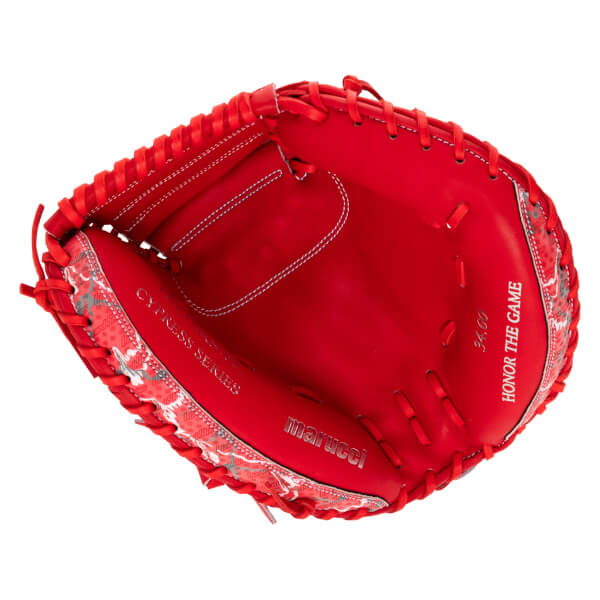 Front view of a red catcher's mitt featuring "CYPRESS SERIES," "marucci," "34.00," and "HONOR THE GAME" text on the palm with patterned red and white trim on the outer edges.