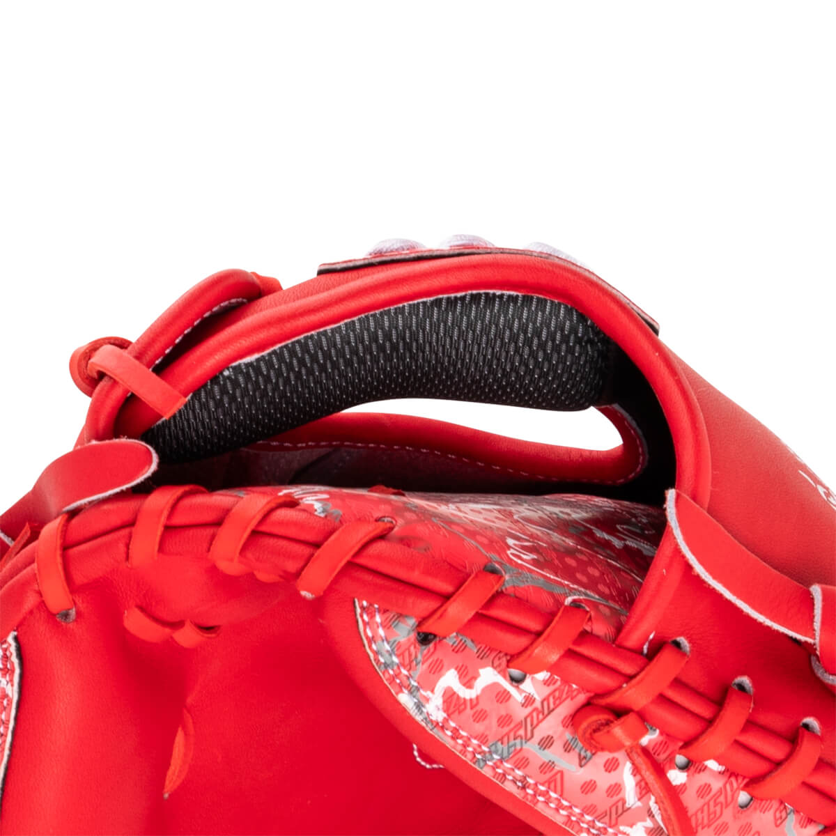 Close-up view of a red Marucci catcher's mitt showing the laced finger stalls and a mesh interior pad.