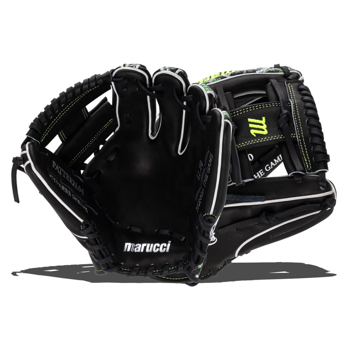 Front view of a black Marucci baseball glove with white stitching, "HONOR THE GAME" text, and a neon green "m" logo.