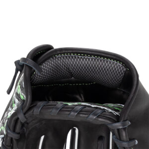 Close-up view of a black baseball glove wrist opening featuring grey mesh padding with lime green stitching and a patterned design.