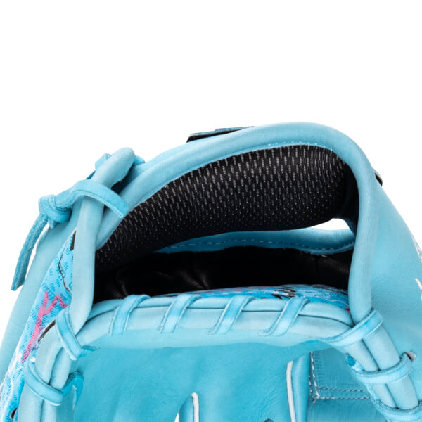 Close-up of the hand opening shows a black mesh-textured wrist pad surrounded by light blue leather with coordinating laces.