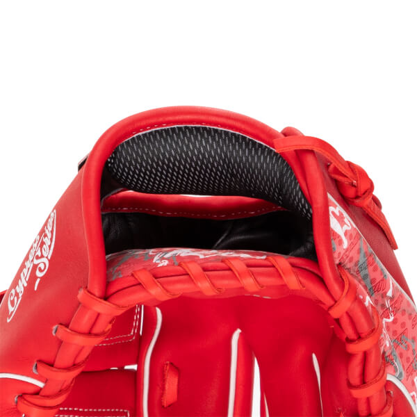 Close-up interior view of a red Marucci baseball glove with "Cypress Series" visible on the side and a black mesh lining.