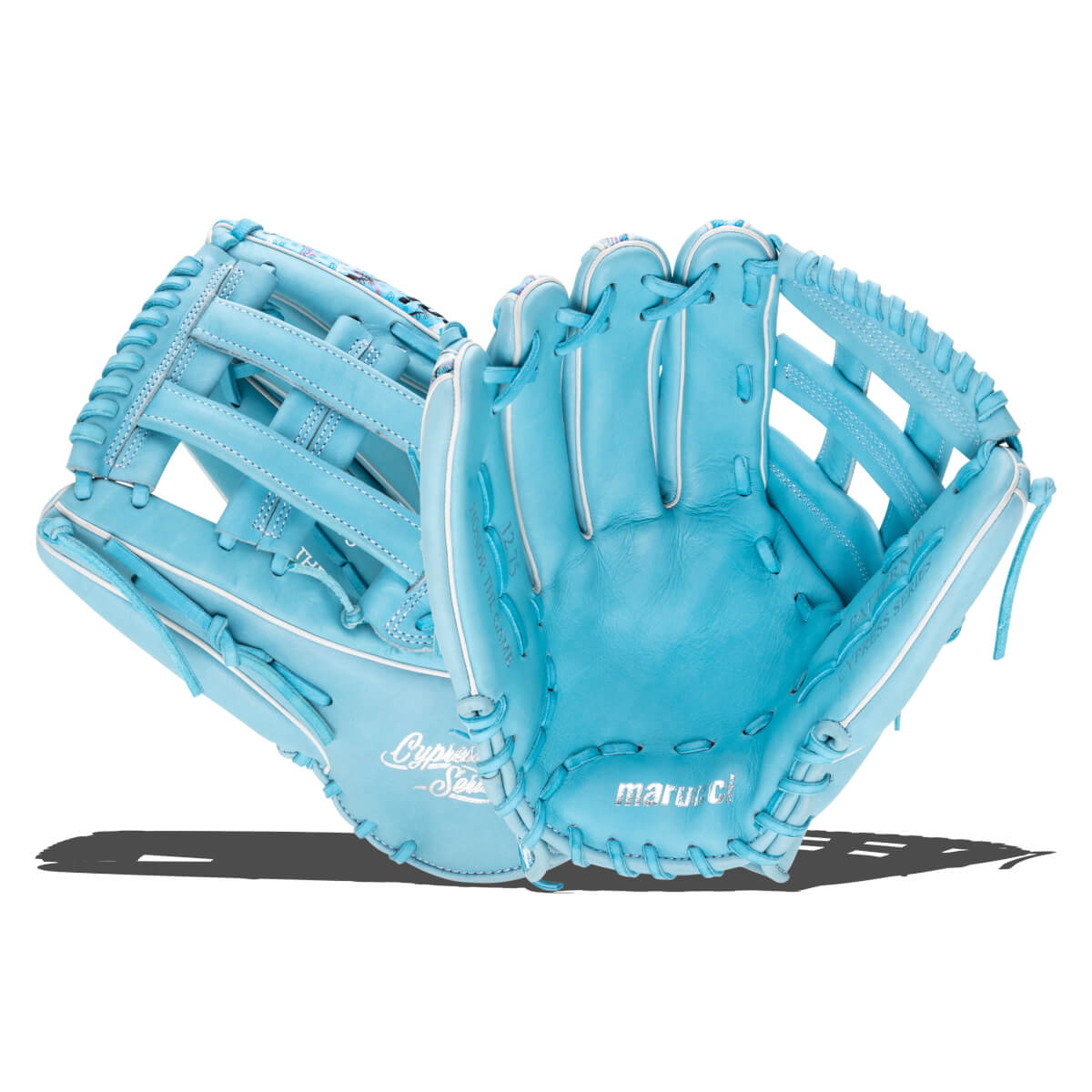 Front and side view of light blue baseball gloves with white piping, featuring "marucci" on the palm and "Cypress Series" text on the side.