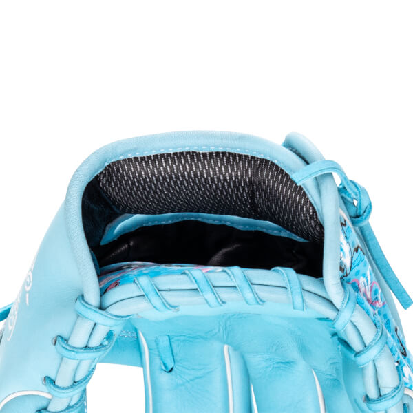 Close-up of the hand opening on the light blue glove features a black mesh wrist pad and colorful floral-patterned interior lining.