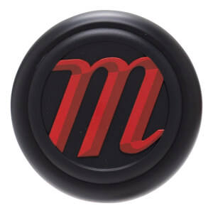 Top-down view of a black knob with a red, striped "m" logo.