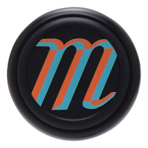 Top-down view of a black cap with an orange and teal "m" logo.