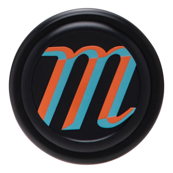Top-down view of a black cap with an orange and teal "m" logo.
