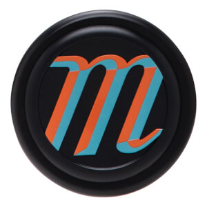 Top-down view of a black cap with an orange and teal "m" logo.