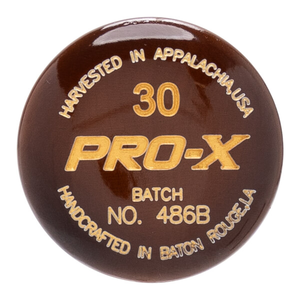Close-up of a dark brown baseball bat end cap with gold PRO-X logo, 30, and production details.