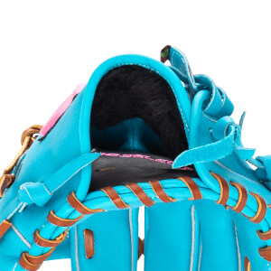 Close-up of a bright blue fastpitch softball glove with black furry wrist lining, brown lacing, and PRO SELECT text.