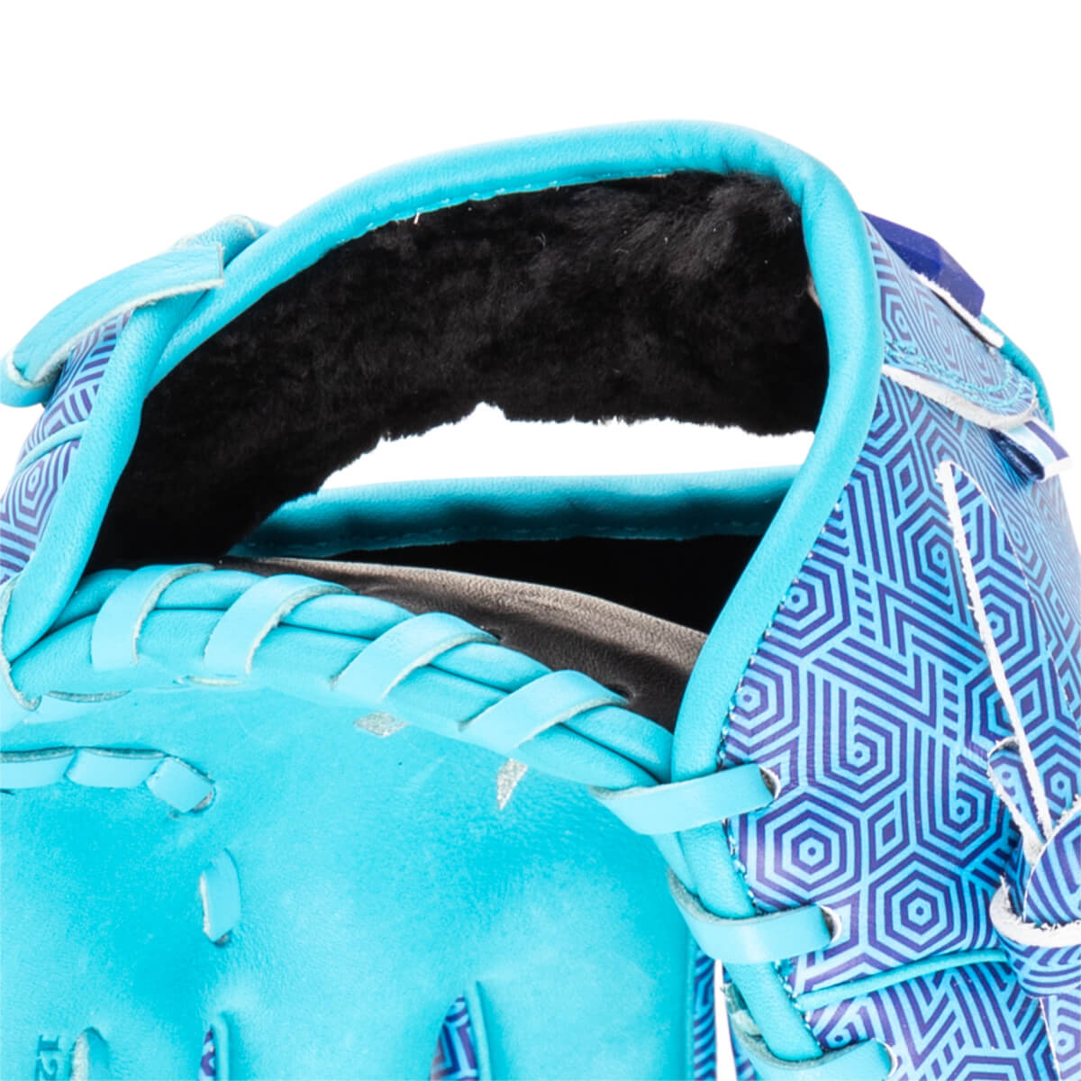 Close-up of a turquoise baseball glove with a blue geometric pattern and black lining.