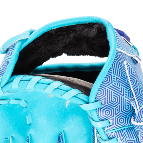 Close-up of a turquoise baseball glove with a blue geometric pattern and black lining.