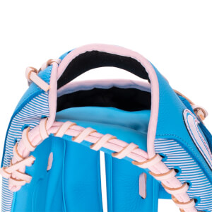 Angled close-up of a blue baseball glove with pink lacing, a striped back, and a white Nike swoosh logo.