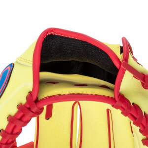 Close-up of a yellow baseball glove with red trim, red lacing, and a black inner lining.