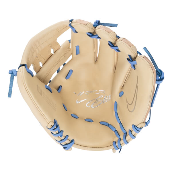 Angled view of a tan baseball glove with light blue lacing, silver Vapor Elite branding, and a Nike swoosh on the palm.