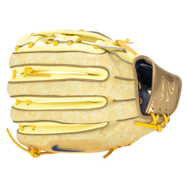Side view of a yellow baseball glove with a cartoon pattern, gold accents, and a blue Nike swoosh.