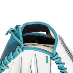 Close-up of a white and teal baseball glove showing the lacing and the inside padding.
