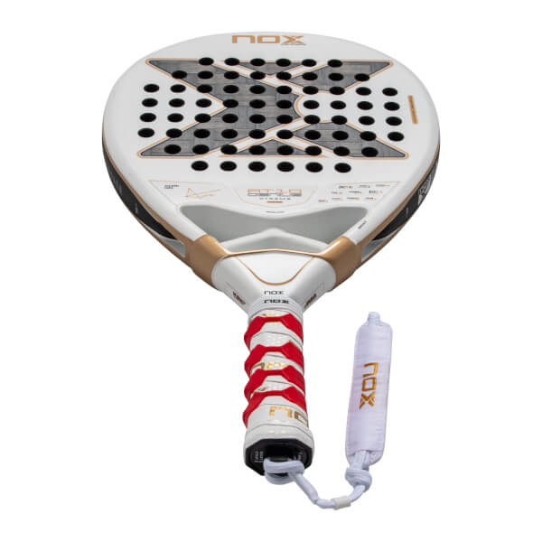 Front view of a white Nox AT10 Genius Xtreme padel racket with a large gray X logo on the face, gold bridge accents, and a red and white textured grip.