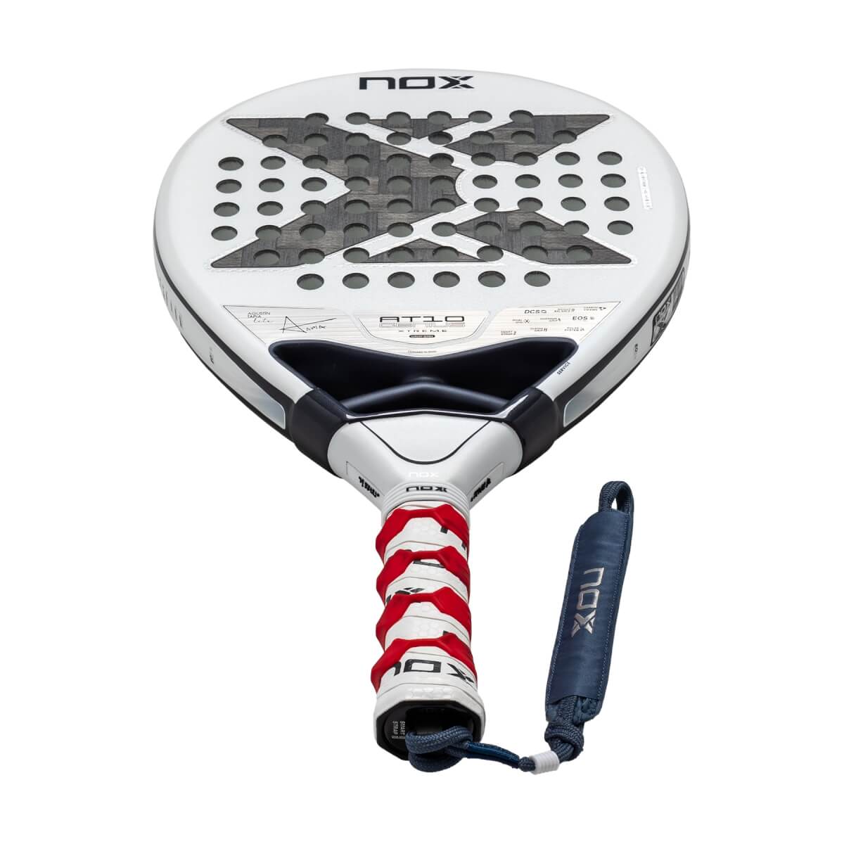 Front view of a white Nox AT10 Genius Xtreme padel racket featuring a large gray X on the face, a red and white textured grip, and a blue NOX-branded wrist strap.