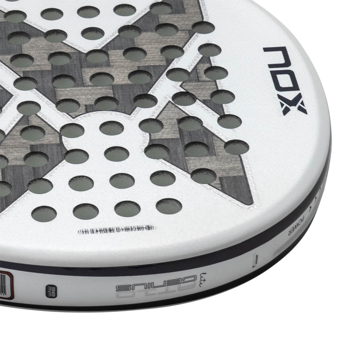 Close-up angled view of a white NOX Genius padel racket head featuring circular holes, a carbon fiber X pattern, and prominent NOX and GENIUS branding.
