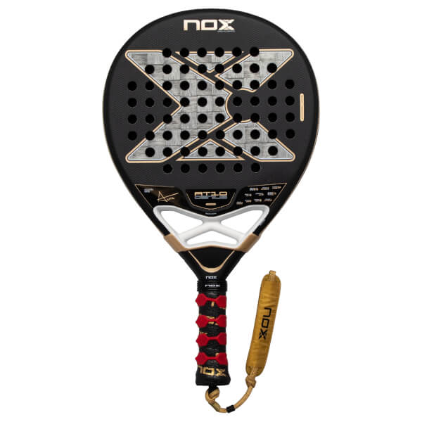 Front view of the black Nox AT10 Genius 18K Alum padel racket featuring a large silver checkered X logo, gold accents, and a red and black textured grip with a gold strap.