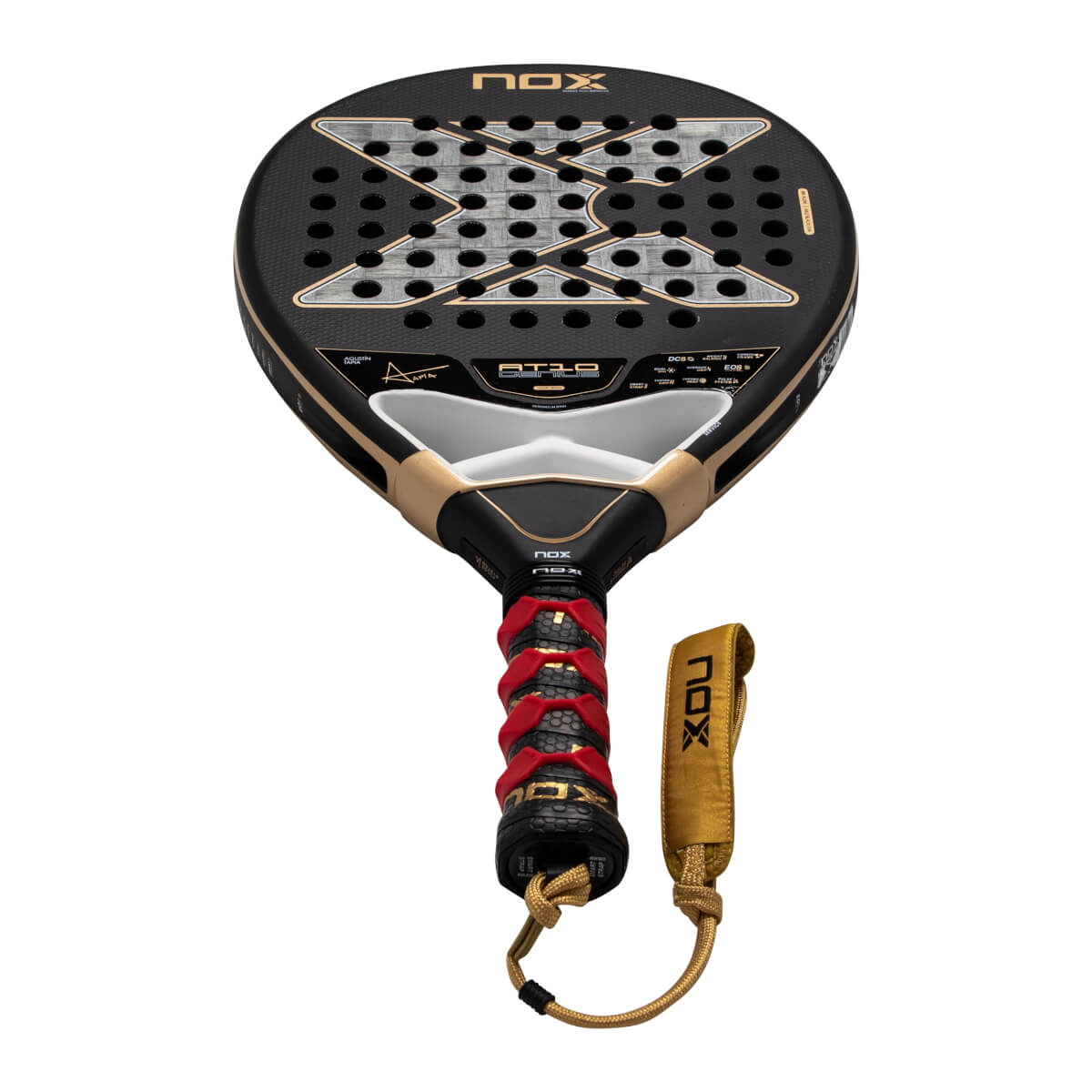 Front view of the black and gold Nox AT10 Genius padel racket featuring a large silver X logo, a red-patterned grip, and a gold wrist strap with the NOX brand name.