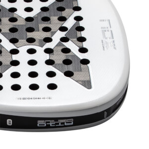 Close-up corner view of a white padel racket featuring a gray patterned 'X' over a perforated face with 'NOX' branding and 'AT10 GENIUS' text on the side edge.