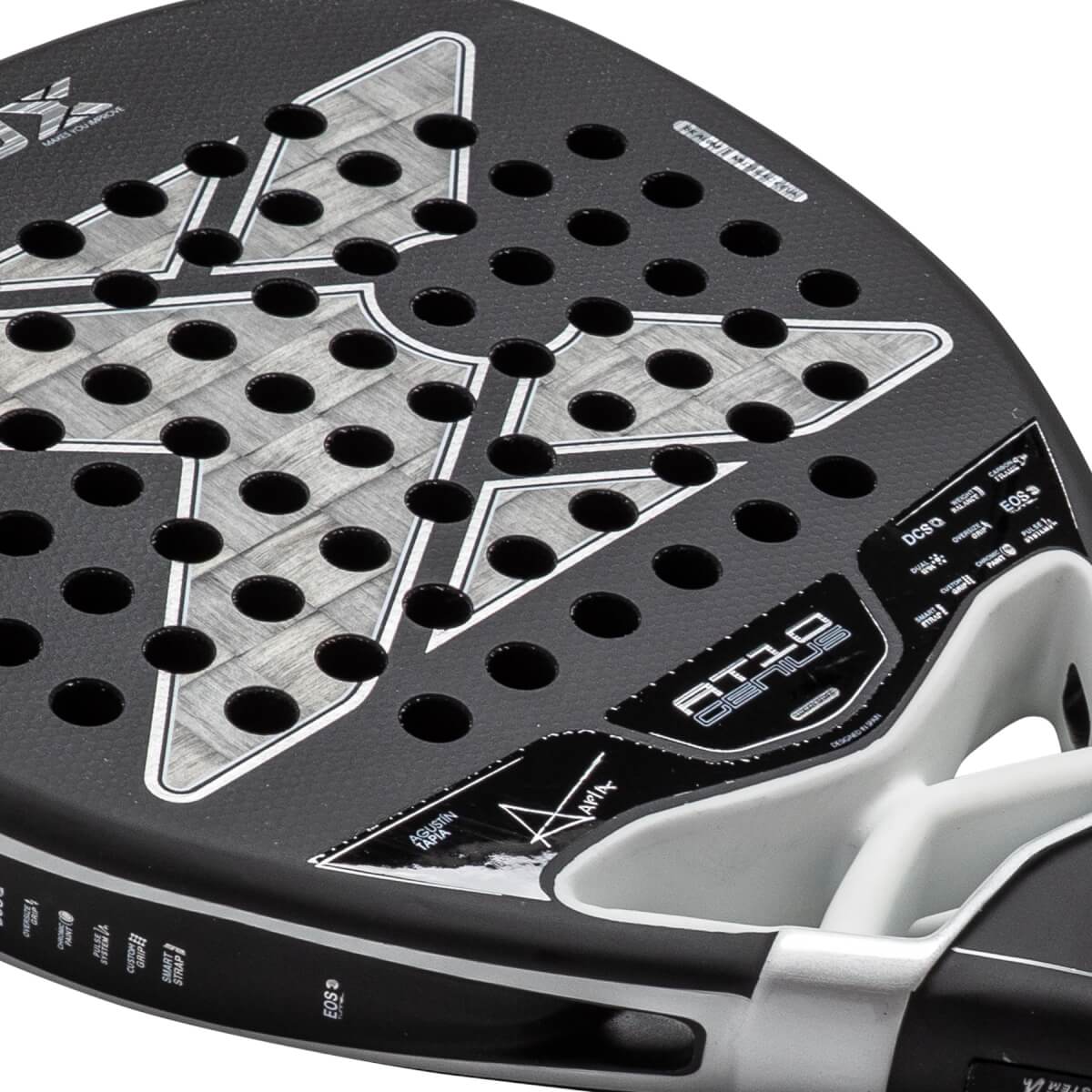 Close-up of a black and gray padel racket with a perforated face, textured carbon fiber pattern, and AT10 GENIUS branding.