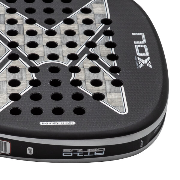 Close-up of a black padel racket with a grey woven carbon fiber face, NOX logo, and AT10 GENIUS on the edge.