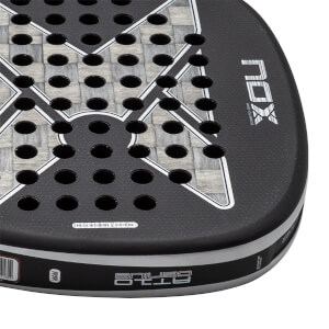 Close-up of a black padel racket with a grey woven carbon fiber face, NOX logo, and AT10 GENIUS on the edge.