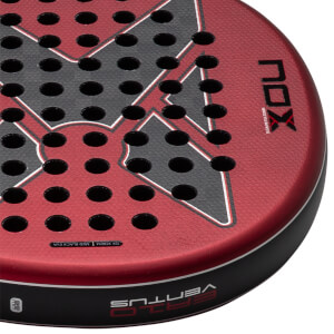 Close-up of the red and black textured padel racket face displaying the NOX and VENTUS logos, perforated holes, and 12K XTREM text along the rim.
