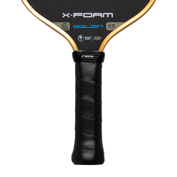 Close-up of the lower paddle face and handle, featuring the X-FOAM, GOLDIN, and NOX logos with a gold-trimmed edge and a black textured grip.