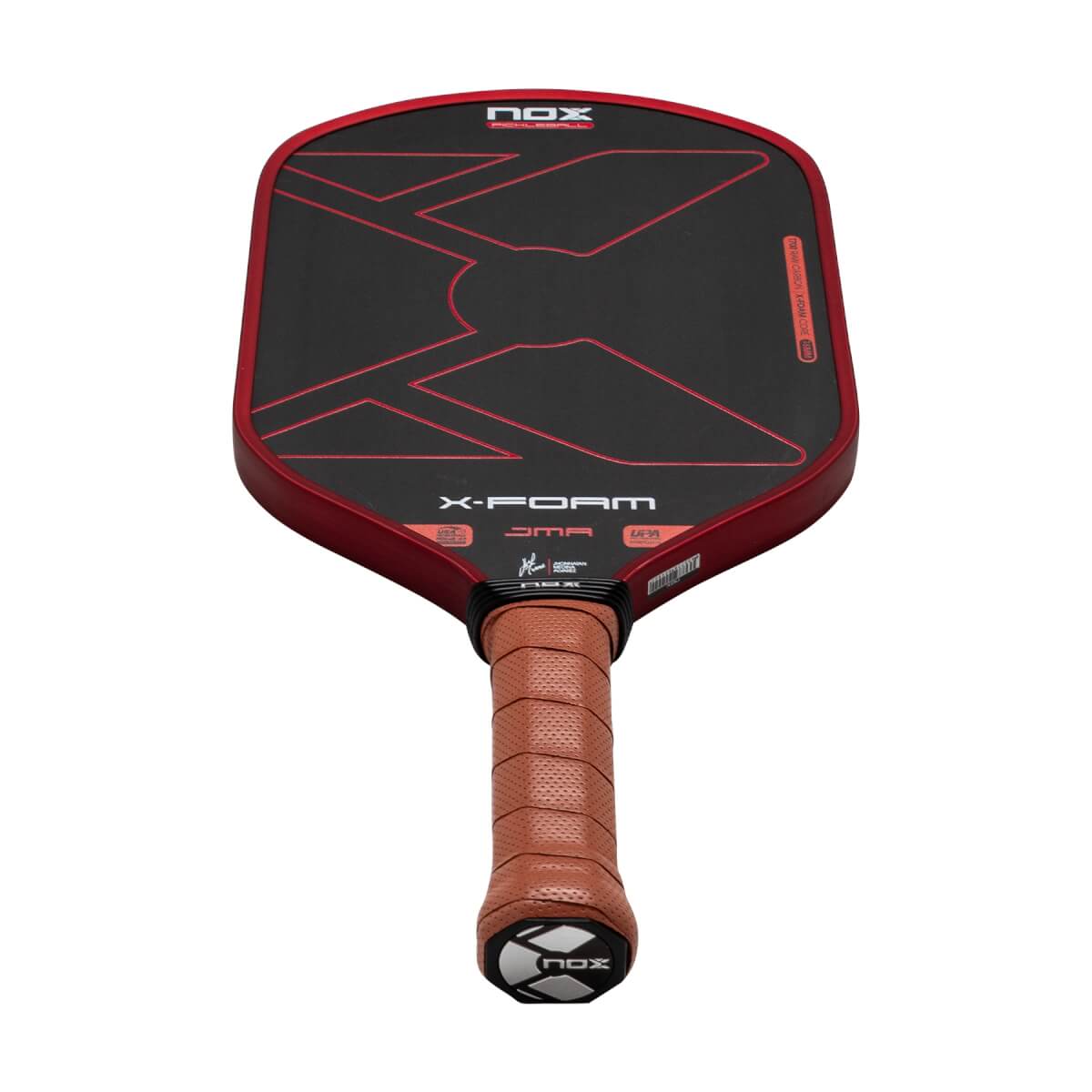 Perspective view from the brown leather grip looking up at the black paddle face with red geometric lines and visible "NOX", "X-FOAM", and "JMA" text.