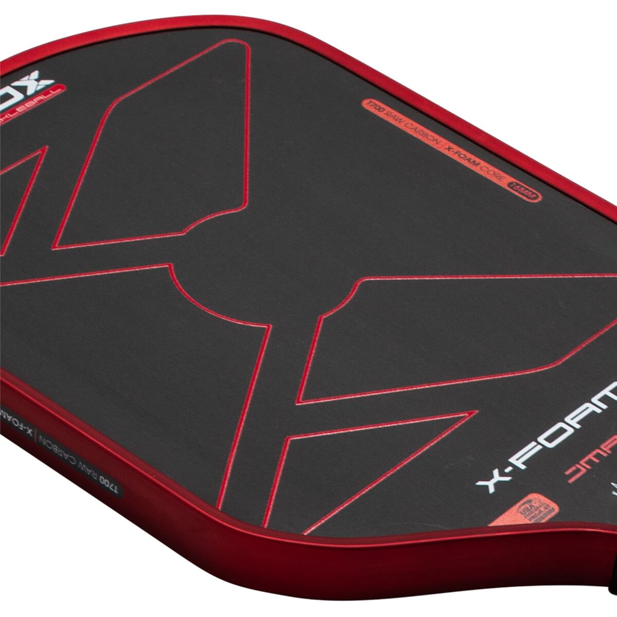 Angled close-up of the black carbon fiber face and red metallic rim, featuring red geometric outlines and the words "X-FOAM" and "T700 RAW CARBON".