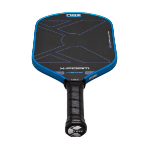 Front view of a blue-rimmed pickleball paddle featuring a black face with a large X design, a black perforated grip, and the words NOX, X-FOAM, and NEXO.