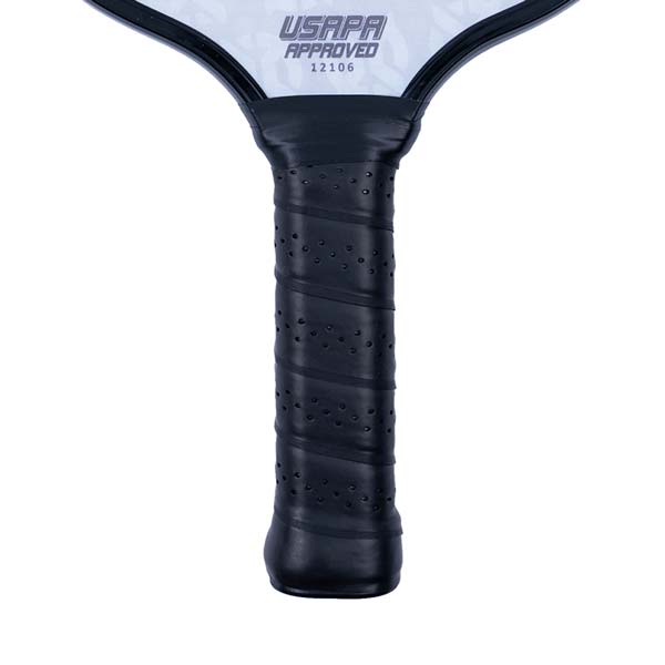 Close-up of a black pickleball paddle grip with perforations and USAPA APPROVED 12106 text.