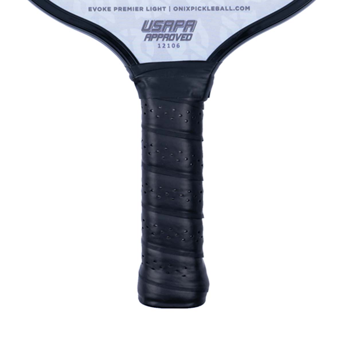 Close-up of a black pickleball paddle grip with perforated texture and USAPA approved stamp.