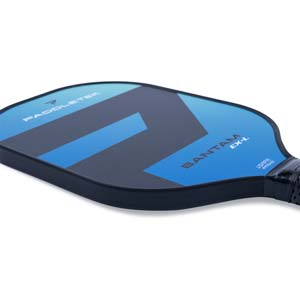Close-up of a blue and black pickleball paddle with PADDLETEK, BANTAM EX-L, and USAPA APPROVED visible.