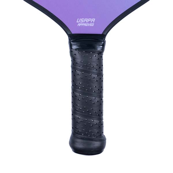 Close-up of a black pickleball paddle grip with USAPA APPROVED text on the purple head.