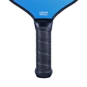 Close-up of a blue pickleball paddle handle with a black perforated grip and USAPA APPROVED text.