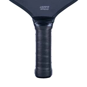 Close-up of a black pickleball paddle grip with USAPA APPROVED text.