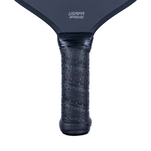 Close-up of a black pickleball paddle grip with a perforated texture and USAPA APPROVED text.