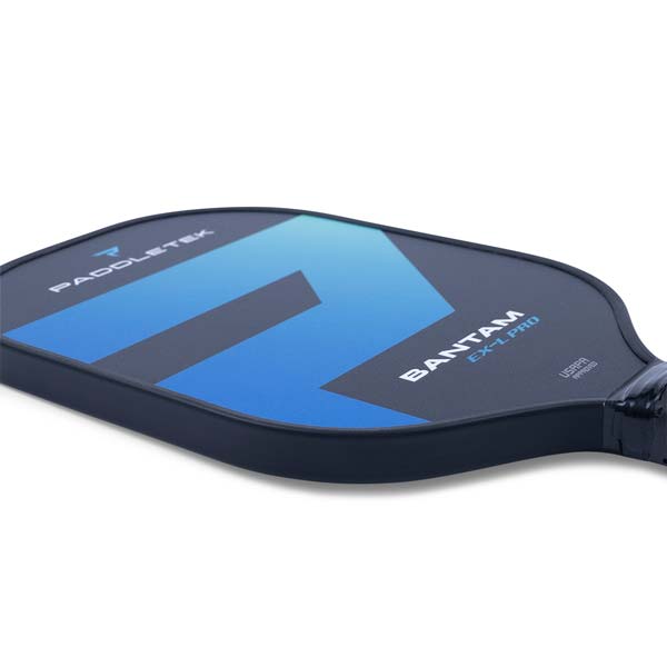 Side view of a dark blue pickleball paddle with a large blue 7 graphic and PADDLETEK BANTAM EX-L PRO text.
