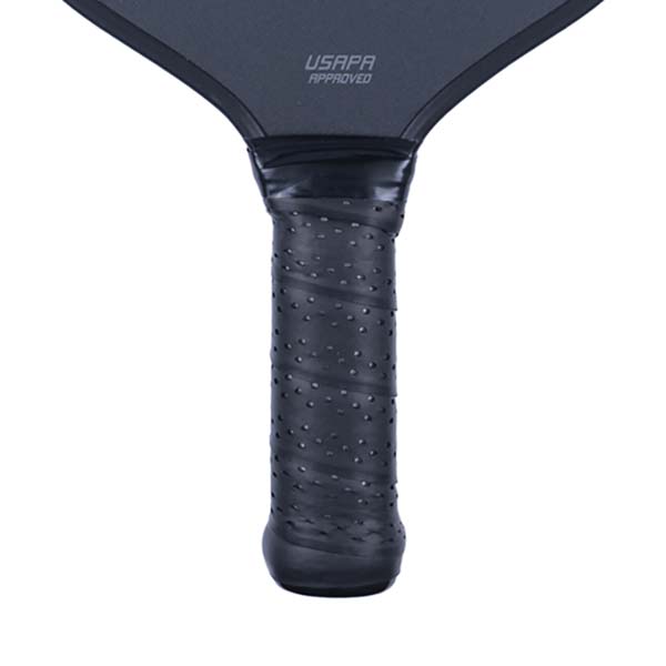 Close-up of a black pickleball paddle grip with a textured surface and USAPA APPROVED text.