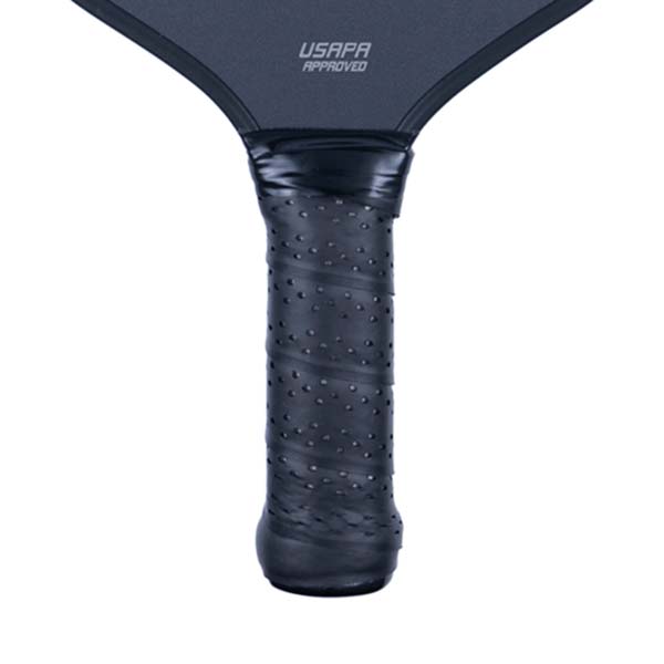 Close-up of a black pickleball paddle grip with a textured surface and USAPA APPROVED text.