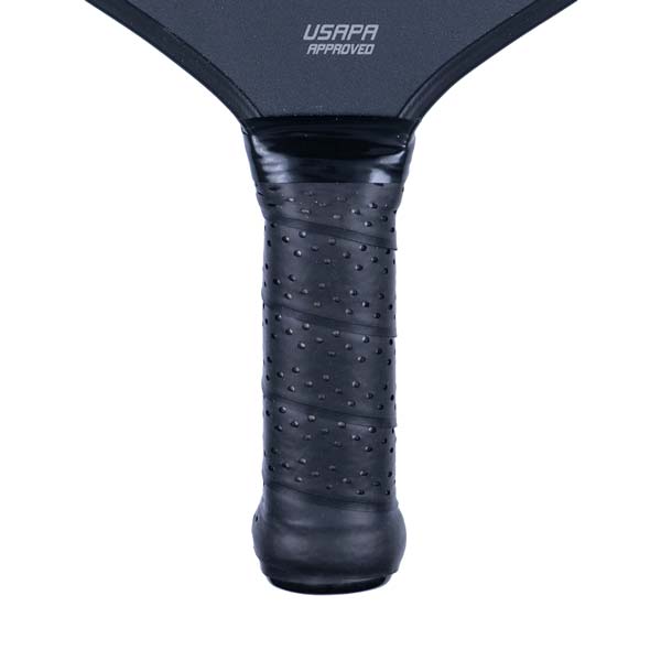 Close-up of a black pickleball paddle grip with USAPA APPROVED text.