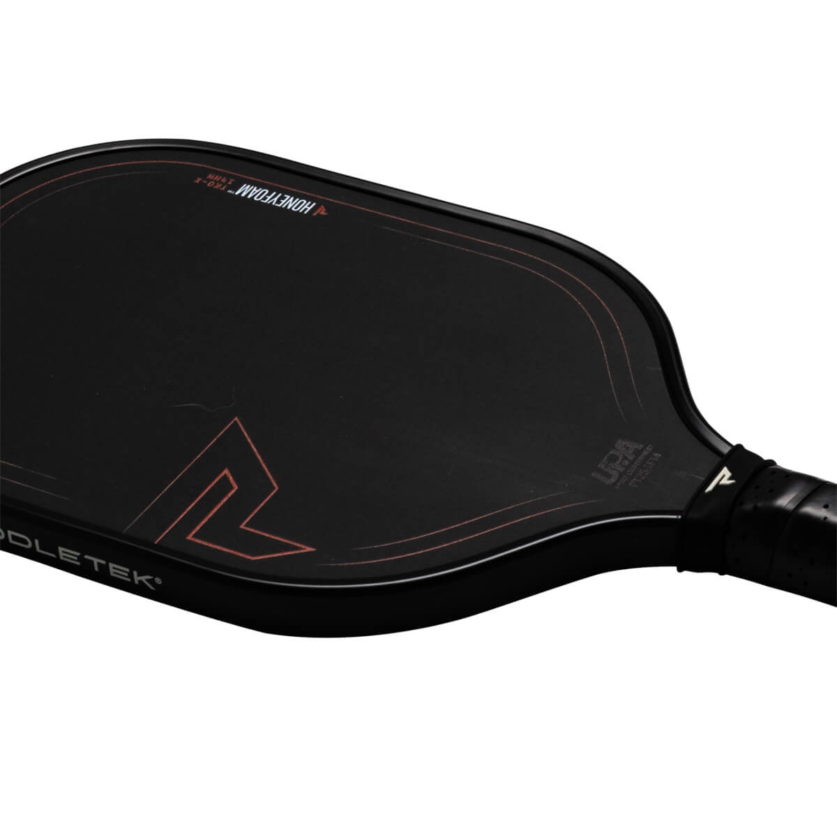 Top-down view of a black pickleball paddle with red accents, showing "HONEYFOAM" and "USA PRO CERTIFIED" text.