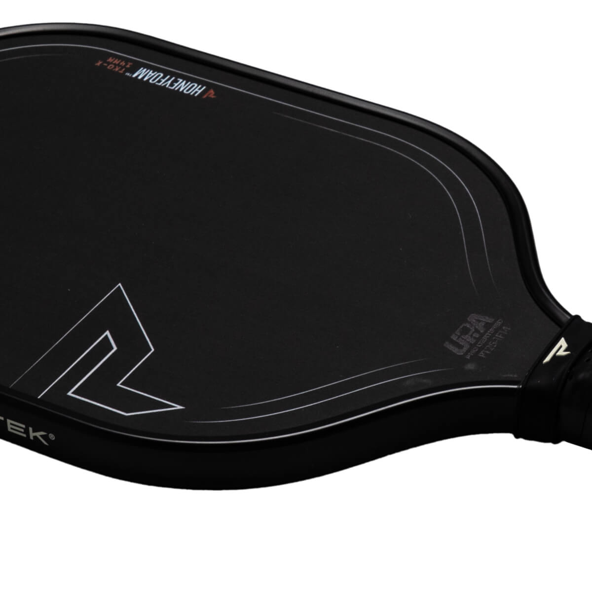 Close-up of a black pickleball paddle showing "HONEYFOAM", "TKO-X", and a white "R" logo.