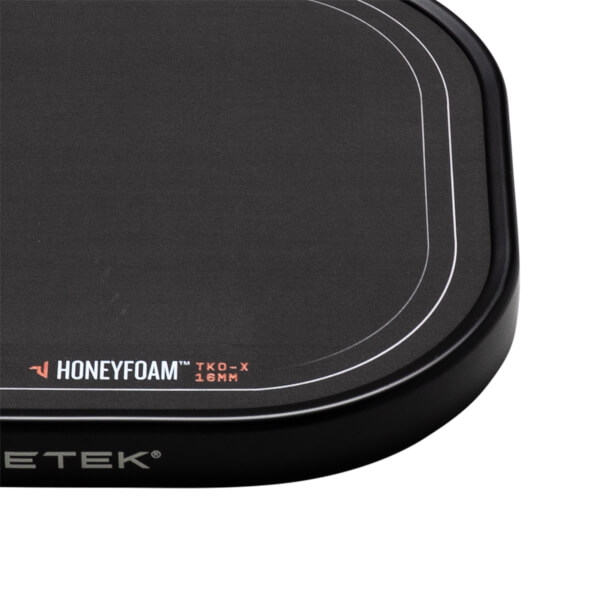 Corner view of the black paddle showing "HONEYFOAM™ TKO-X 16MM" and "PADDLETEK®" text.